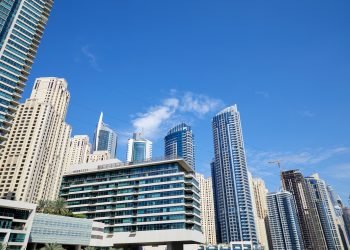 Dubai Marina skyscrapers low angle view in a sunny day, clear blue sky in Dubai