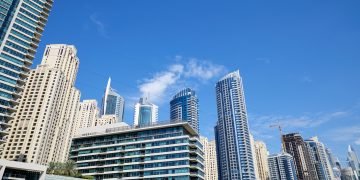 Dubai Marina skyscrapers low angle view in a sunny day, clear blue sky in Dubai