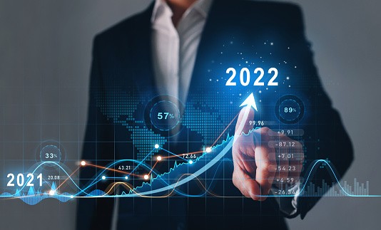 Businessman draws  increase arrow graph corporate future growth year 2021 to 2022.   Development to success and motivation