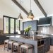 Kitchen island with four stools and two pendant lights above