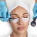 Close-up of the girl's face with closed eyes. The hand of the master tint to the eyelash with a cotton swab in cosmetology clinic.