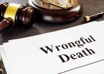 Wrongful Death report and gavel in a court.