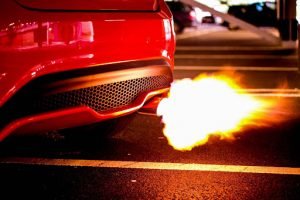 A picture of an exhaust tip shooting out flames.