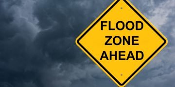 Flood Zone Ahead Caution Sign Storm Background
