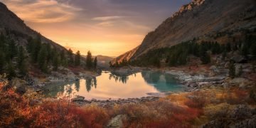 Pink Sky And Mirror Like Lake On Sunset With Red Color Growth On Foreground, Altai Mountains Highland Nature Autumn Landscape Photo. Beautiful Russian Wilderness Scenery Image.