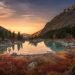 Pink Sky And Mirror Like Lake On Sunset With Red Color Growth On Foreground, Altai Mountains Highland Nature Autumn Landscape Photo. Beautiful Russian Wilderness Scenery Image.